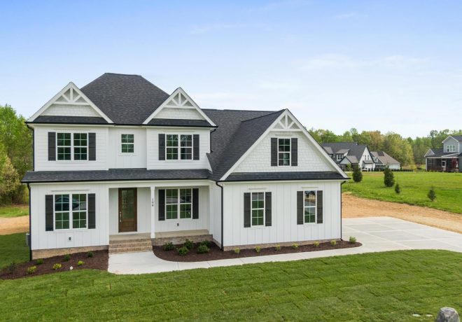 Aerial view of a modern two-story house with spacious lawn in Youngsville, NC.