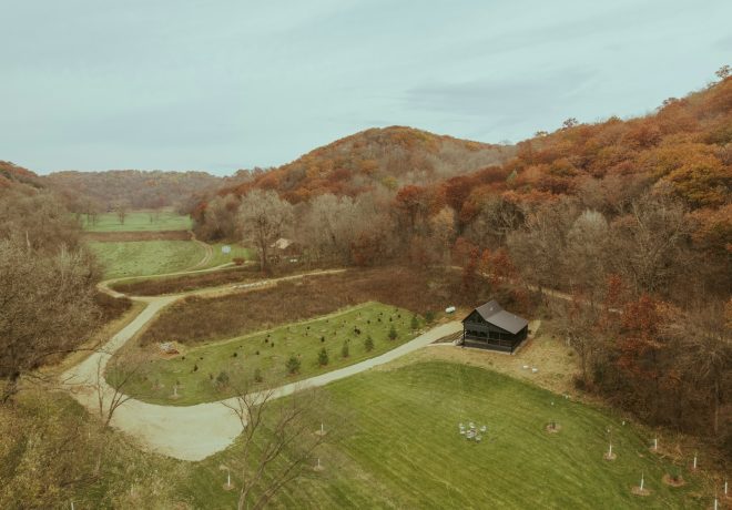 an aerial view of a farm in the fall