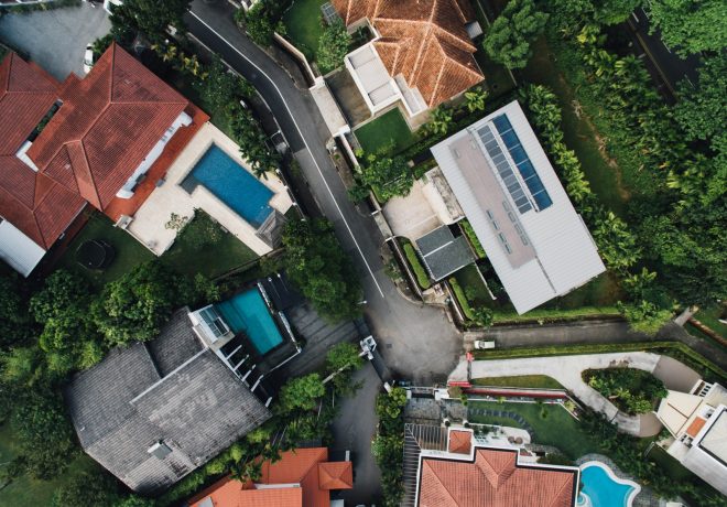 bird's eye view photo of concrete houses and street